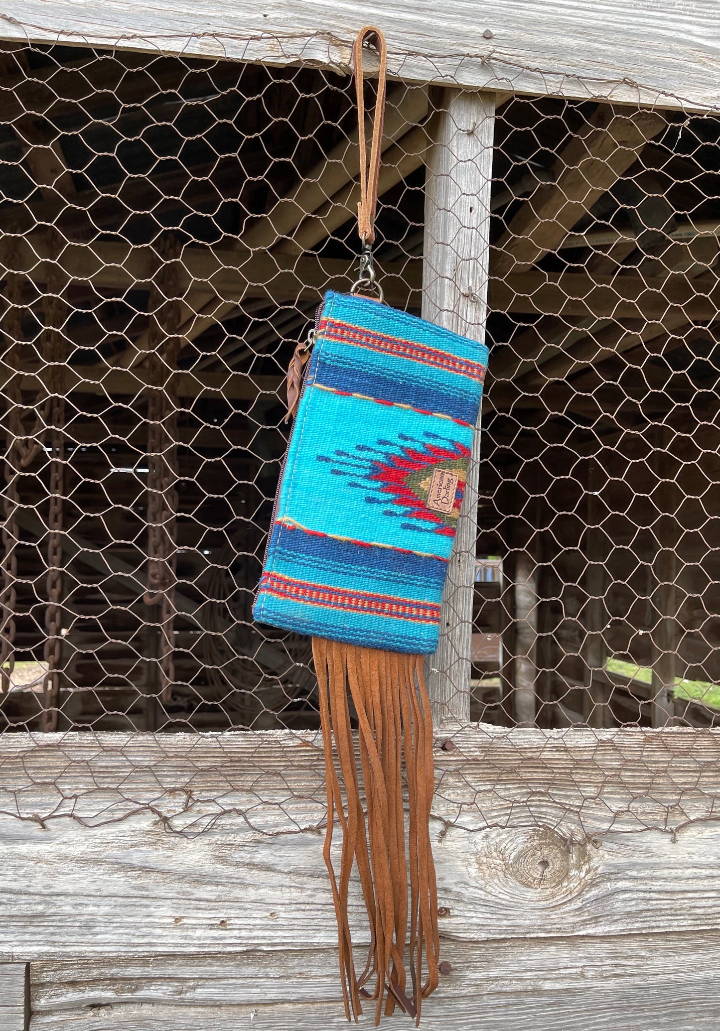 American Darling turquoise saddle blanket wristlet with fringe